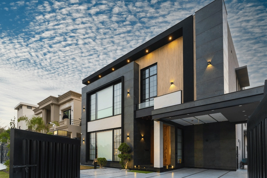 mid century modern home with black exterior and lots of windows